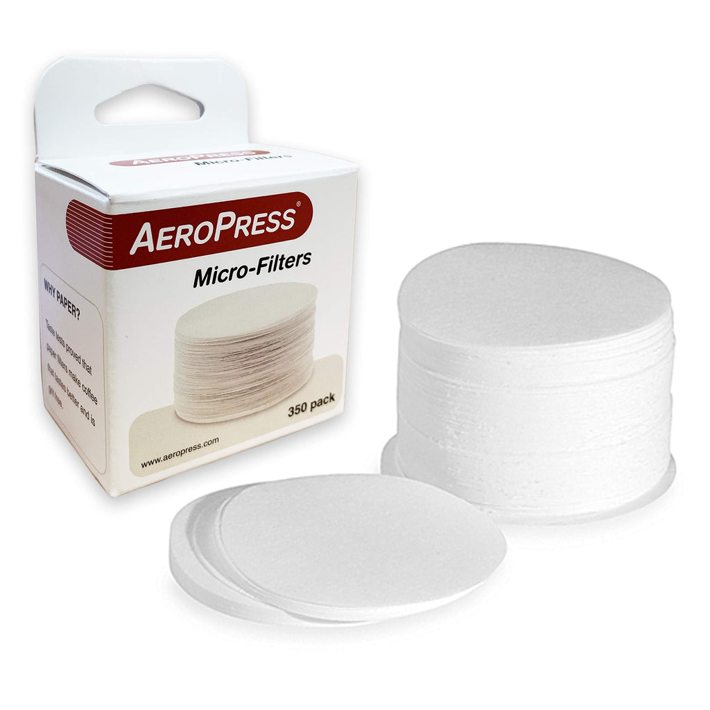 A pack of white Aeropress micro filters, with some filters visible outside the packaging.