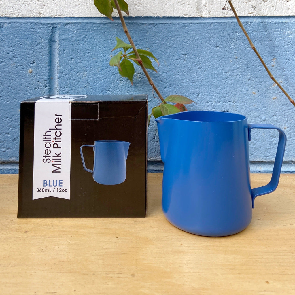 A blue Rhino Stealth Milk Jug with a blue pitcher, placed next to its packaging box with a '360ML' size indication.
